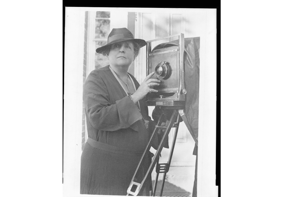 Frances Benjamin Johnston with camera.